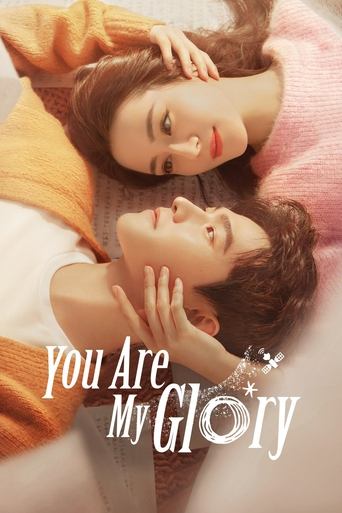 The poster features two young people lying close together on a bed, bathed in soft, warm lighting. The woman wears a pink sweater, while the man is dressed in a white shirt and orange sweater. Their expressions convey intimacy and affection, with gentle touches on each other's faces. The title "Y...