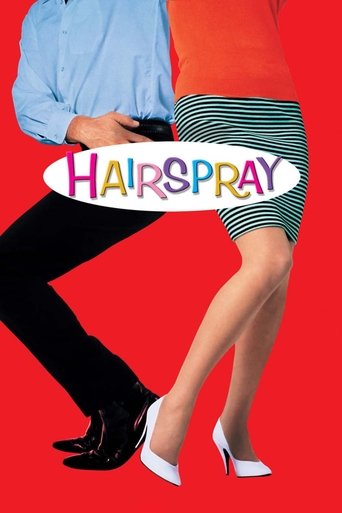 The poster features a vibrant red background with two people in colorful outfits—blue and orange shirts, black pants, and striped skirts. The word "HAIRSPRAY" is prominently displayed in colorful letters across their midsections, capturing the playful and energetic mood of the film.