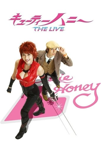 The poster features two energetic characters in a dynamic pose against a vibrant pink background. The red-haired character exudes confidence with a red top and black pants, while the blonde character adds a playful touch with a brown jacket and white hat. The overall composition is lively and col...