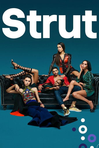 The poster features five women lounging on a black couch against a teal background, with bold white text reading "Strut." The mood is casual and relaxed, capturing the essence of a pop culture show.