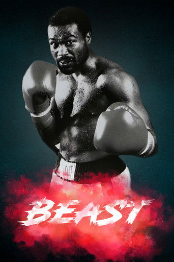 A muscular boxer stands in a dramatic pose against a dark, moody background, exuding strength and intensity. The poster features bold red and white text, evoking a sense of power and urgency. The overall mood is intense and cinematic, capturing the essence of a high-stakes boxing match.