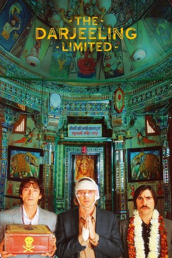 The poster features three men in a richly decorated room with vibrant green and gold tones. The central figure wears a white turban, while the others wear traditional attire. The overall mood is mystical and serene, evoking the spiritual atmosphere of the Darjeeling region.