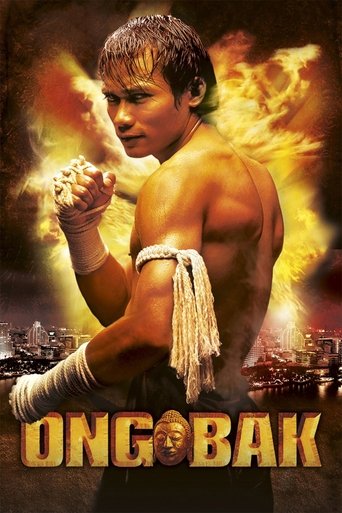 The poster features a muscular man in a white bandana, surrounded by fiery explosions and flames. The title "ONG-BAK" is prominently displayed in bold, golden letters. The overall mood is intense and dramatic, suggesting a high-stakes action movie.