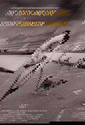 This black-and-white poster captures a poignant moment of a woman walking her dog along a waterfront, evoking a sense of nostalgia and quiet resilience. The muted tones and sepia filter enhance the film's historical and emotional depth, while the simple composition emphasizes the human connection...