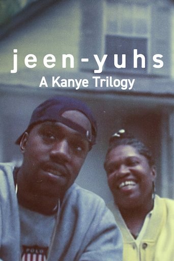 The poster features two smiling African American men against a muted, slightly desaturated background. The warm tones of their skin and clothing contrast with the cool, grayish backdrop. The text "jeen-yuhs" and "A Kanye Trilogy" are overlaid in bold white font, emphasizing the musical connection.