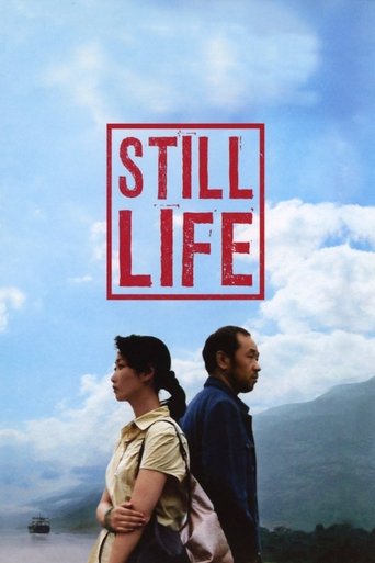 The poster features two people standing against a dramatic sky with clouds and mountains, evoking a sense of longing and introspection. The bold red title "STILL LIFE" stands out prominently, suggesting themes of enduring moments or unfulfilled dreams.