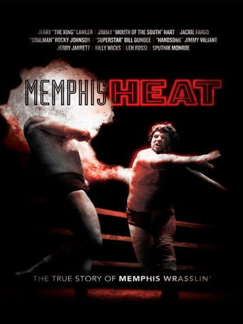 The poster features two wrestlers in a boxing ring, with one wrestler in a black tank top and the other in a white tank top, both exuding intensity. The background is dark with red and orange hues, creating a dramatic atmosphere. The title "Memphis Heat" is prominently displayed in bold red lette...