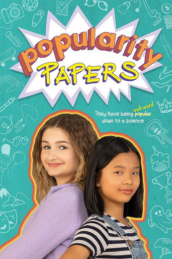The poster features two young girls with a playful, youthful mood. The background is filled with colorful doodles and the title "Popularity Papers" in bold, eye-catching letters. The overall design suggests a fun, engaging, and relatable theme for the show.