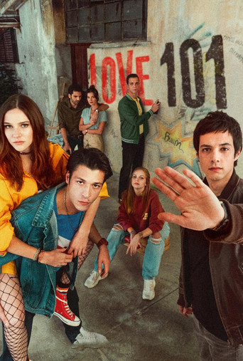The poster features six young people in a gritty urban setting, with vibrant colors like red, blue, and yellow creating a lively atmosphere. The mood is energetic and youthful, capturing the essence of a teen drama.