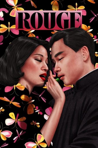 The poster features a dramatic scene between a man and woman in black, surrounded by vibrant flowers and butterflies. The title "ROUGE" is prominently displayed in bold pink letters, creating a striking contrast against the colorful background. The mood is intense and romantic, capturing a moment...