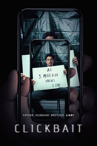 The poster features a dark, suspenseful scene with a man holding up a sign that reads "AT 5 MILLION VIEWS - 1 DIE." The background is filled with a mysterious, shadowy figure, creating an eerie and ominous mood. The title "CLICKBAIT" is prominently displayed at the bottom in bold, white letters. ...