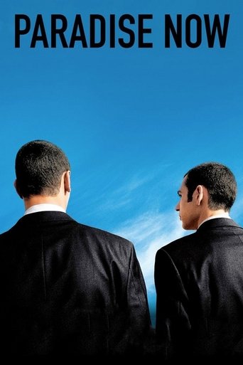 The poster features two men in dark suits standing against a clear blue sky, evoking a sense of mystery and intrigue. The bold text "PARADISE NOW" dominates the top, suggesting an exciting and thrilling narrative.
