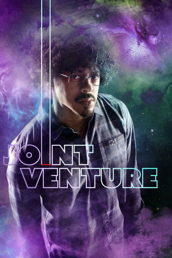 The poster features a man with dark hair and glasses, wearing a dark shirt, set against a vibrant purple and green cosmic background. The word "Joint Venture" is prominently displayed in bold, modern typography. The mood is mysterious and futuristic, suggesting a blend of creativity and innovation.