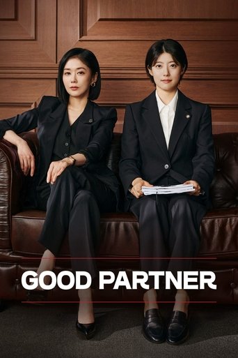 The poster features two women in professional black suits, seated on a leather couch against a warm wooden backdrop. The mood is formal yet intimate, suggesting a professional yet personal relationship. The title "Good Partner" is prominently displayed at the bottom, emphasizing the show's focus ...
