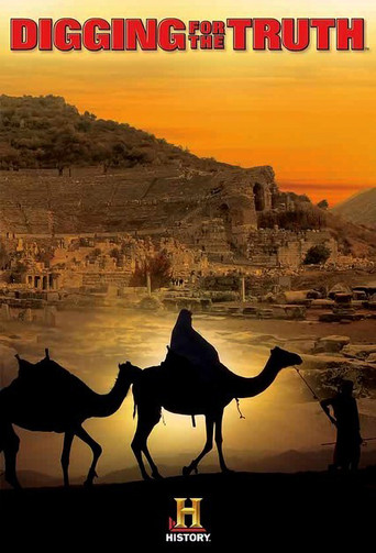 The poster features a silhouette of a camel rider against a warm sunset, with two camels in the foreground. The vibrant orange and yellow hues evoke a sense of mystery and adventure, while the dark silhouette adds depth and drama.