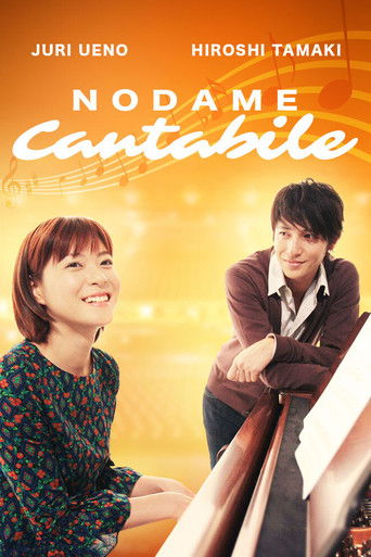 This vibrant poster features two smiling actors, Juri Ueno and Hiroshi Tamaki, exuding warmth against a golden background. The title "Nodame Cantabile" glows in elegant script, evoking a romantic and musical atmosphere.