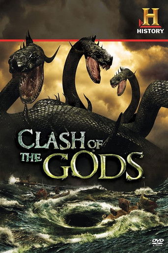 The poster features three menacing dragons with open mouths, their scales gleaming under a dramatic sky. The title "Clash of the Gods" is prominently displayed in bold, golden letters. The overall mood is intense and epic, with swirling dark clouds and turbulent water at the bottom, evoking a sen...