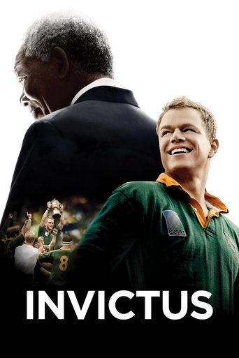 The poster features a powerful silhouette of a man in a suit against a white background, while a smiling man in a green jersey stands in the foreground. The bold title "INVICTUS" anchors the image, evoking themes of triumph and resilience.