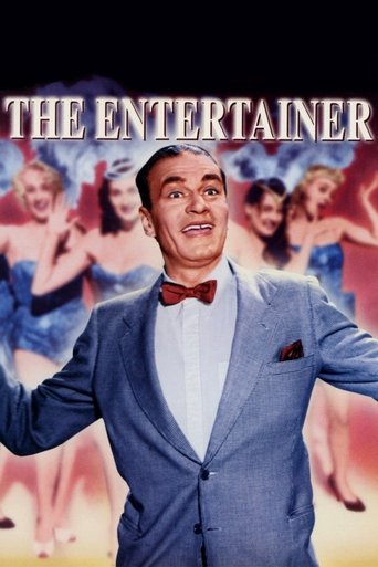 The movie poster features a charismatic man in a blue suit and bow tie, exuding confidence and joy. Behind him, a group of women in colorful outfits dance energetically, adding a lively and festive atmosphere. The warm colors and dynamic composition evoke a sense of fun and entertainment.