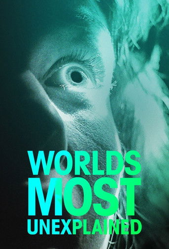 The poster features a close-up of a person's face with an intense, eerie gaze, bathed in a haunting teal hue. The title "World's Most Unexplained" is prominently displayed in bold, neon green text, evoking mystery and suspense.