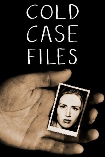 A hand holds a Polaroid photo of a woman against a stark black background. The minimalist design evokes mystery and suspense, with the bold title "Cold Case Files" anchoring the image.