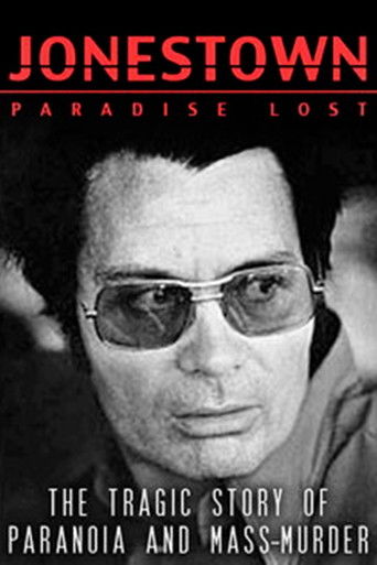 The poster features a somber black-and-white portrait of a man in sunglasses, evoking a sense of mystery and tragedy. The title "Jonestown: Paradise Lost" is prominently displayed in bold red letters, emphasizing the film's dark and ominous theme. The overall design conveys a serious and melancho...