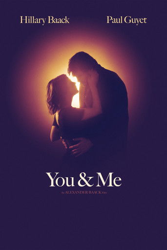 The poster features silhouettes of two people embracing against a warm, glowing background. The deep purple and orange hues create an intimate and romantic atmosphere, evoking a sense of deep connection and emotional intimacy.