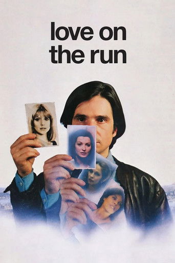 The poster features a man with dark hair holding a photograph of a woman, surrounded by translucent images of other people. The muted tones and soft lighting create a somber mood, emphasizing themes of loss and connection.