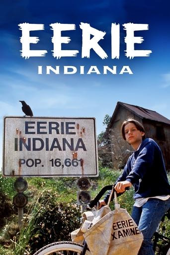 The poster features a woman in a blue shirt pushing a bicycle with a sign reading "Eerie Indiana, Pop. 16,661" against a backdrop of a rustic house and lush greenery. The sky is bright blue, and the overall mood is nostalgic and slightly mysterious, evoking a sense of rural Americana.