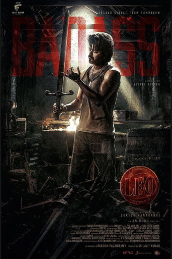The poster features a gritty, dark scene with a muscular man holding a sword, exuding strength and danger. The color palette is dominated by deep blacks, fiery reds, and metallic grays, creating an intense atmosphere. The overall mood is one of suspense and action, promising a thrilling cinematic...