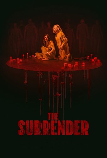 The poster features two figures seated on a circular platform surrounded by candles, with a dark, ominous atmosphere. The title "THE SURRENDER" is prominently displayed in bold red letters at the bottom, suggesting themes of sacrifice and tragedy.