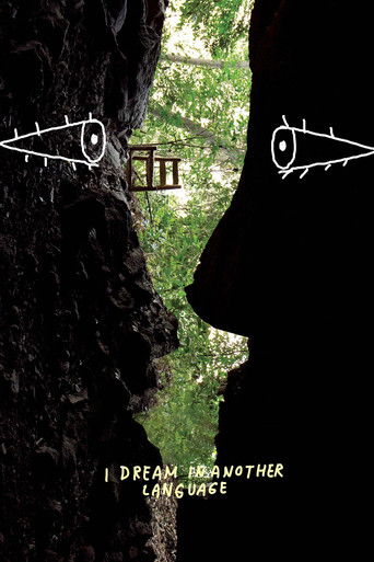 The poster features a dark silhouette of a person's profile against a lush green forest backdrop, with two glowing eyes in white lines framing the scene. The title "I Dream in Another Language" is subtly placed at the bottom in gold text. The mood is mysterious and introspective, evoking a sense ...