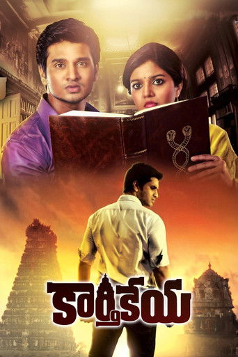 The poster features a dramatic scene with a man in a purple shirt and a woman in a yellow dress holding a book, set against a warm, golden sunset backdrop. Below them, a man in a white shirt walks away from the camera, evoking a sense of mystery and adventure. The title "Karthikeya" is prominentl...