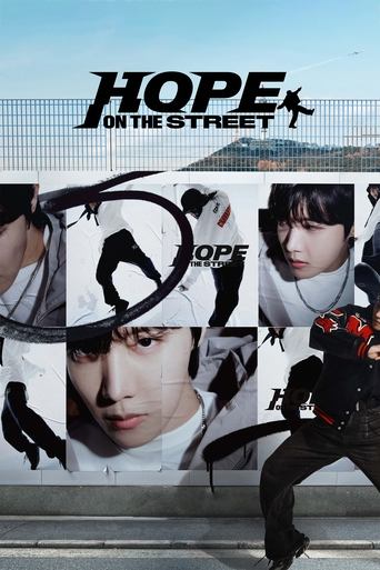 The poster features a dynamic street scene with a man in a black hoodie running toward the viewer, while others in various poses appear behind him. The bold "HOPE ON THE STREET" title stands out against a backdrop of a fence and sky. The overall mood is energetic and gritty, capturing the essence...