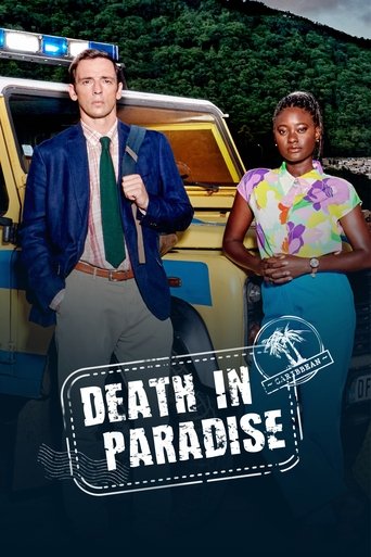 The poster features a man in a blue jacket and green tie standing beside a yellow police vehicle, while a woman in a colorful floral top and teal skirt stands next to it. The tropical setting with lush green hills and palm tree emblem adds to the exotic atmosphere. The bold title "Death in Paradi...