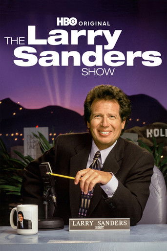 The Larry Sanders Show poster features Larry Sanders in a suit, holding a pen, against a backdrop of a city skyline at dusk. The warm tones of the image evoke a relaxed, friendly atmosphere, capturing the essence of a daytime talk show.