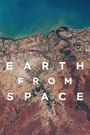 The poster features a breathtaking aerial view of Earth's continents, with vibrant blues and warm earth tones. The text "EARTH FROM SPACE" is prominently displayed in bold white letters, creating a striking contrast against the natural landscape. The image evokes a sense of wonder and exploration...