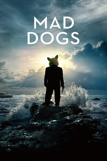 The poster features a lone figure in a dark suit standing on a rocky shore, silhouetted against a dramatic sky filled with swirling clouds and crashing waves. The title "MAD DOGS" is prominently displayed in bold white letters at the top. The overall mood is mysterious and intense, evoking a sens...
