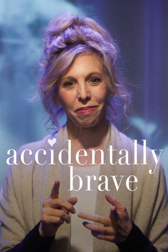 The poster features a woman with purple hair, wearing a beige cardigan, making a playful gesture with her hands. The soft, dreamy blue and white background adds to the whimsical mood. The title "Accidentally Brave" is prominently displayed in elegant white text, emphasizing the film's quirky and ...