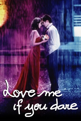 The poster features a romantic couple embracing under a rain-slicked street at night, bathed in purple and blue hues. The title, "Love Me If You Dare," is elegantly written in white script at the bottom, evoking a dreamy, passionate atmosphere.