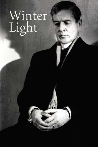 The poster features a somber portrait of a man in a dark suit against a muted background, evoking a melancholic mood. The title "Winter Light" is elegantly placed in white text, suggesting a film about hope amidst darkness.
