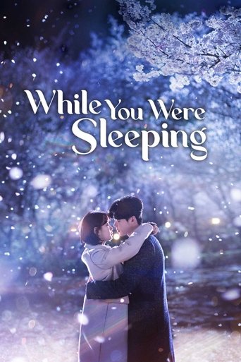 The poster features a tender couple embracing under cherry blossoms, with soft snowfall and twinkling lights creating a romantic and dreamy atmosphere.