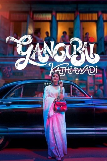 The poster features a glamorous woman in a white and pink dress holding a red clutch, standing before a vintage car. Above her, the title "GANGUBAI KATHIAWADI" is written in bold, stylized white letters. The background shows a bustling street scene with people in colorful clothing, creating a vib...