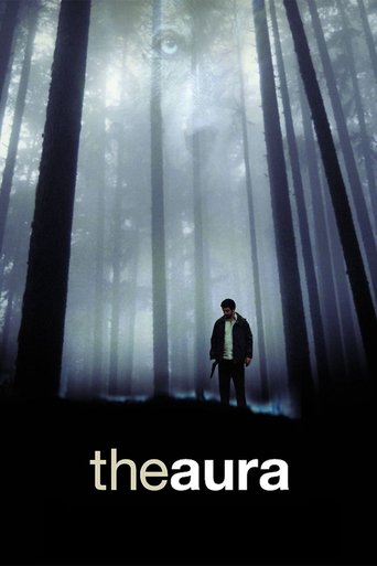 The poster features a solitary figure standing in a misty forest, illuminated by ethereal light filtering through tall trees. The dark, moody atmosphere evokes mystery and suspense, with the title "theaura" prominently displayed at the bottom.