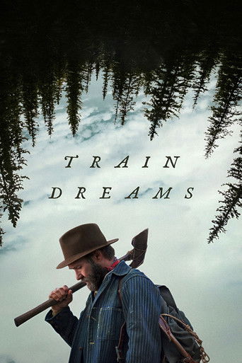The poster features a rugged man with a beard and hat, holding a shovel, set against a backdrop of pine trees and a cloudy sky. The title "TRAIN DREAMS" is prominently displayed in bold, white letters. The overall mood is adventurous and nostalgic, evoking a sense of wanderlust and the allure of ...