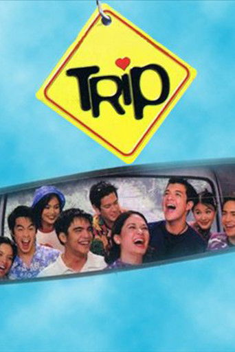 The poster features a group of smiling people in a car, set against a bright blue sky. A yellow diamond-shaped sign with "Trip" in bold letters hangs from the top, suggesting a journey. The cheerful and vibrant colors evoke a sense of adventure and fun.