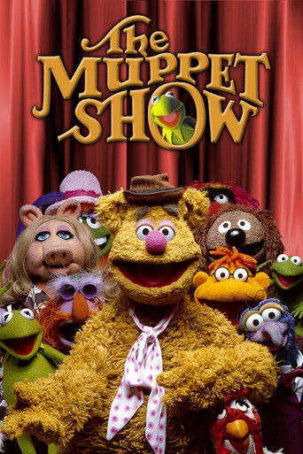 The Muppet Show poster features a vibrant ensemble of colorful puppets, including Kermit the Frog and Elmer Fudd, set against a dramatic red curtain backdrop. The warm golden hues of the puppets contrast beautifully with the deep red background, creating an inviting and theatrical atmosphere that...