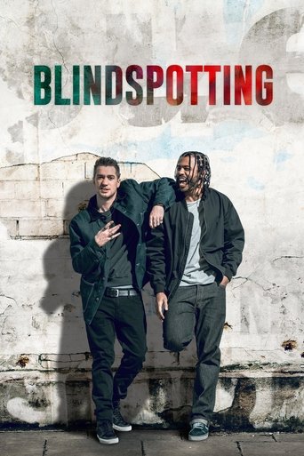 The poster features two men in dark jackets against a weathered wall, with one hand resting on the other's shoulder. The title "BLINDSPOTTING" is prominently displayed in bold, colorful letters at the top. The overall mood is gritty and intense, suggesting a thriller or action movie.