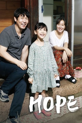 The poster features a warm family portrait with a man in a gray shirt, a young girl in a light dress, and a woman in a white top, all smiling warmly. The soft, natural lighting and earthy tones create a cozy, hopeful atmosphere. The word "HOPE" is prominently displayed in bold, white letters at t...