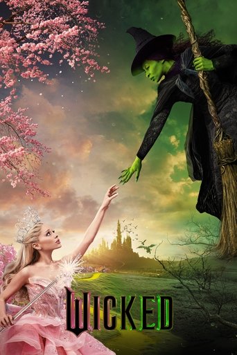 A fairy in a pink dress reaches up to a witch on a tree branch, surrounded by cherry blossoms and a mystical green landscape.